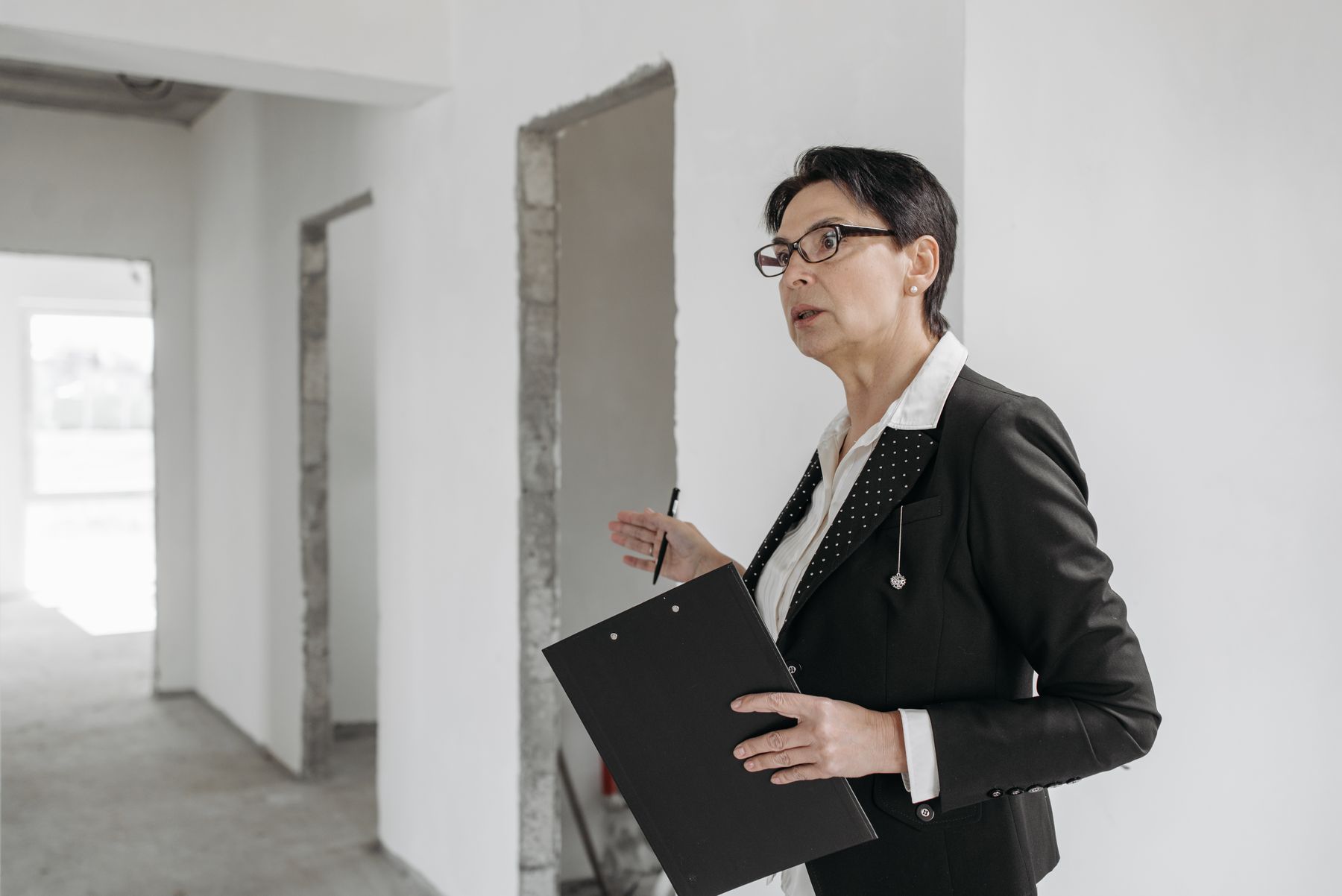 An African property professional reviewing a building site