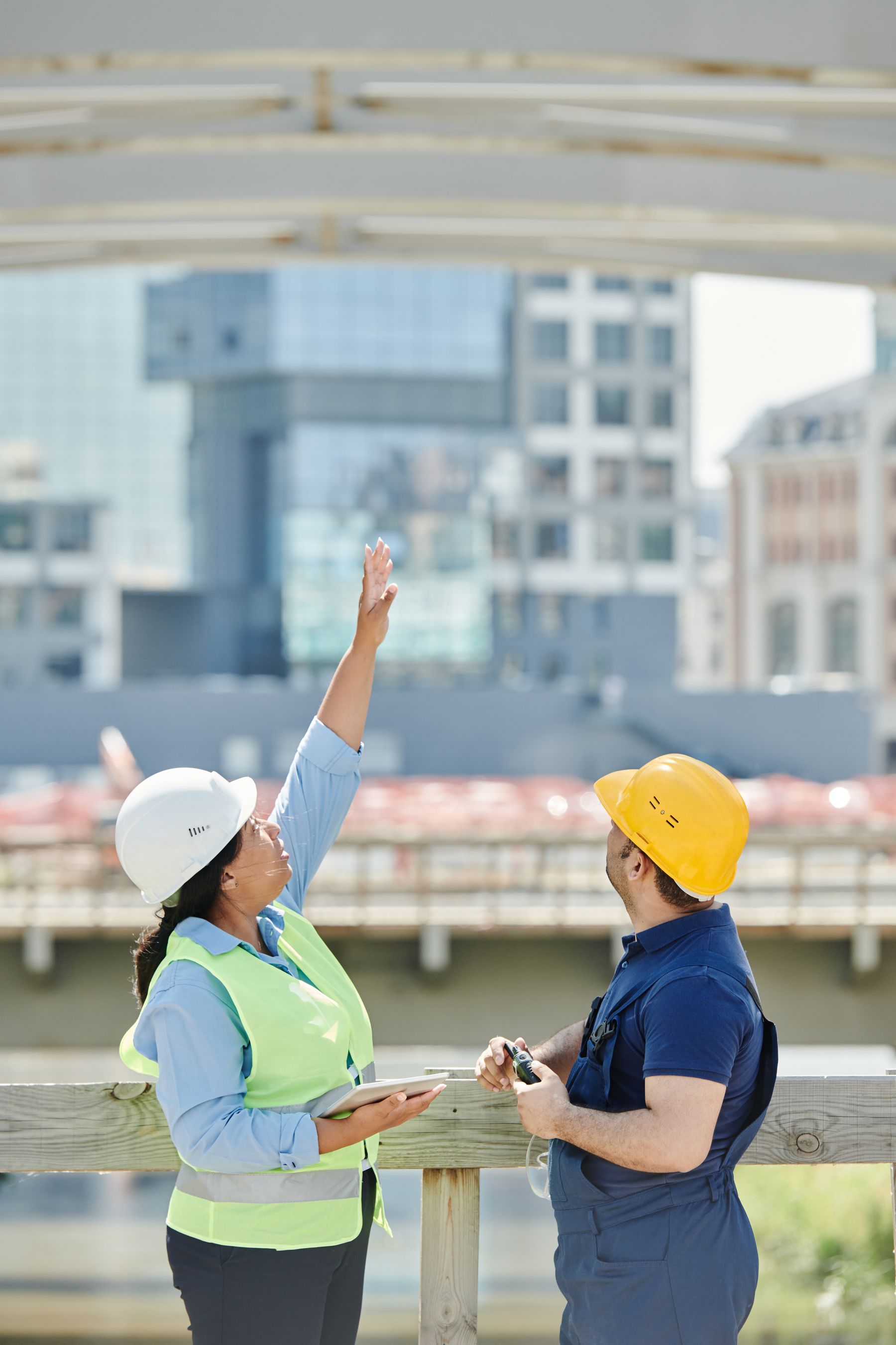 Professionals reviewing plans at an African construction site